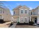 Attractive two-story townhouse with a covered front porch and well-maintained landscaping at 2259 Crosscut Dr, Charlotte, NC 28214