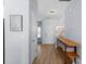 Bright hallway featuring a console table, neutral paint, and wood-look flooring at 2259 Crosscut Dr, Charlotte, NC 28214