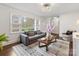 Inviting living room with a comfortable sofa, stylish rug, and ample natural light at 2908 Enfield Rd, Charlotte, NC 28205