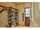 Organized basement storage area with metal shelving, peg board and convenient access to the outdoors at 3400 Tracelake Dr, Matthews, NC 28105