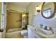 Bathroom with a shower, vanity, toilet, and mirror at 3400 Tracelake Dr, Matthews, NC 28105