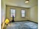 Bedroom with two windows and carpet at 3400 Tracelake Dr, Matthews, NC 28105