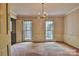 Elegant dining room featuring a chandelier and large windows, perfect for entertaining guests at 3400 Tracelake Dr, Matthews, NC 28105