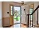 Inviting foyer with hardwood floors and views of the landscaped front yard through the open doorway at 3400 Tracelake Dr, Matthews, NC 28105