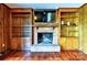 Living room features a classic brick fireplace with built-in shelving, providing a warm and inviting space for relaxation at 3400 Tracelake Dr, Matthews, NC 28105