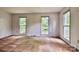 Bright living room with multiple windows offering ample natural light and a cozy atmosphere at 3400 Tracelake Dr, Matthews, NC 28105