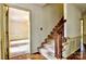 View of the carpeted staircase with wooden railing and banister at 3400 Tracelake Dr, Matthews, NC 28105