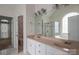Bathroom features double sinks, large mirror, and a separate tub and shower with glass door at 3516 Araglin Dr, Gastonia, NC 28056