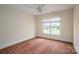 Bedroom with neutral walls, carpeted floor, and a window overlooking the yard at 3516 Araglin Dr, Gastonia, NC 28056