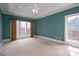 Spacious bedroom with trey ceilings, carpeted floors, large windows, and ceiling fan at 3516 Araglin Dr, Gastonia, NC 28056