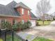 Charming brick home with well-manicured landscaping, a paved driveway and a side-entry garage at 3516 Araglin Dr, Gastonia, NC 28056