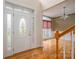 Spacious foyer with hardwood floors, decorative front door, and staircase at 3516 Araglin Dr, Gastonia, NC 28056