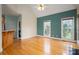Inviting living room with hardwood floors and large windows providing ample natural light at 3516 Araglin Dr, Gastonia, NC 28056