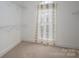 Walk-in closet featuring neutral carpet and wire shelving for storage at 3516 Araglin Dr, Gastonia, NC 28056