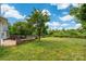 Lush backyard with brick patio and plenty of space at 4036 Sawmill Trace Dr, Charlotte, NC 28213