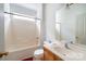 Bathroom with a shower/tub combo, single sink vanity, and neutral color scheme at 4036 Sawmill Trace Dr, Charlotte, NC 28213