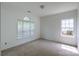 Bedroom featuring neutral carpet, white walls and windows bringing in natural light at 4036 Sawmill Trace Dr, Charlotte, NC 28213