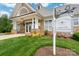 Community clubhouse with well-manicured lawn and attractive signage at 4036 Sawmill Trace Dr, Charlotte, NC 28213