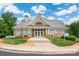 Charming clubhouse featuring stone accents, a symmetrical design and well-manicured landscaping at 4036 Sawmill Trace Dr, Charlotte, NC 28213