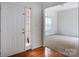 Bright entryway features wood floors and a view into a carpeted room at 4036 Sawmill Trace Dr, Charlotte, NC 28213