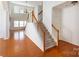 Bright foyer with hardwood floors and stairway leading upstairs at 4036 Sawmill Trace Dr, Charlotte, NC 28213