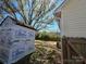 Spacious backyard featuring a wooden fence, lush trees, and a shed under construction at 4210 Runaway Cir, Monroe, NC 28110