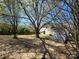 Spacious backyard with mature trees and a partial fence, offering a private outdoor space at 4210 Runaway Cir, Monroe, NC 28110