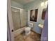 Bathroom with a shower and bathtub combo with a sliding glass door and a modern sink and toilet at 4210 Runaway Cir, Monroe, NC 28110