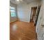 Bedroom with hardwood floors, white walls, a ceiling fan and window with plenty of natural light at 4210 Runaway Cir, Monroe, NC 28110