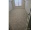 Bright bedroom features soft carpeting and a window allowing ample natural light at 4210 Runaway Cir, Monroe, NC 28110