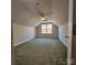 Spacious bedroom featuring neutral paint, ceiling fan, and a sunny window at 4210 Runaway Cir, Monroe, NC 28110