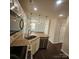 Granite counters, tiled backsplash, and modern pendant lights highlighting the bright kitchen at 4210 Runaway Cir, Monroe, NC 28110