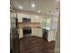 A stylish kitchen with stainless steel appliances, granite countertops, and pendant lighting at 4210 Runaway Cir, Monroe, NC 28110