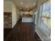 Modern kitchen with stainless steel appliances, granite countertops, and hardwood floors at 4210 Runaway Cir, Monroe, NC 28110
