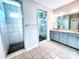 Modern bathroom with a tile shower, glass doors, and double vanity at 4253 Stream Dale Nw Cir, Concord, NC 28027
