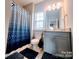 Well-lit bathroom featuring a bathtub and vanity at 4253 Stream Dale Nw Cir, Concord, NC 28027