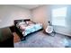Comfortable bedroom with a queen-sized bed and nearby baby swing at 4253 Stream Dale Nw Cir, Concord, NC 28027