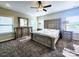 Spacious main bedroom features lots of light, a ceiling fan, and a furniture set at 4253 Stream Dale Nw Cir, Concord, NC 28027
