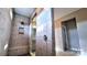 Tiled walk-in shower with a built-in bench and rainfall shower head at 4253 Stream Dale Nw Cir, Concord, NC 28027