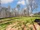 A shot of the backyard with newly planted grass, bordered by a wood line and trees at 4262 Brandy Creek Ct, Clover, SC 29710