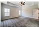 Spacious bedroom with trey ceilings featuring two windows offering ample natural lighting at 4262 Brandy Creek Ct, Clover, SC 29710