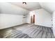 Bright bedroom with a dormered ceiling, carpet and two doors at 4262 Brandy Creek Ct, Clover, SC 29710