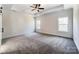 Bright, spacious bedroom features plush carpeting, tray ceiling, a ceiling fan, and ample natural light at 4262 Brandy Creek Ct, Clover, SC 29710