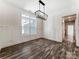 Bright dining room featuring modern lighting fixture, wainscoting and natural light at 4262 Brandy Creek Ct, Clover, SC 29710