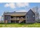 Exterior view of home showing a large back deck with wooden rails and stairs to the yard at 4262 Brandy Creek Ct, Clover, SC 29710