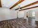 An open living area with wood beam ceiling and stylish wood floors at 4262 Brandy Creek Ct, Clover, SC 29710