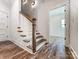 Elegant staircase with wood treads, white risers, and decorative balusters at 4262 Brandy Creek Ct, Clover, SC 29710