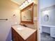 Bathroom features a wooden vanity, with granite countertops and a separate vanity in the background at 4401 Coachwood Ln, Gastonia, NC 28056