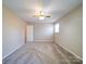 Spacious bedroom with neutral walls, a ceiling fan, and carpeted flooring at 4401 Coachwood Ln, Gastonia, NC 28056