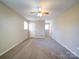 The expansive bedroom features soft lighting and comfortable carpeting, offering a welcoming retreat at 4401 Coachwood Ln, Gastonia, NC 28056